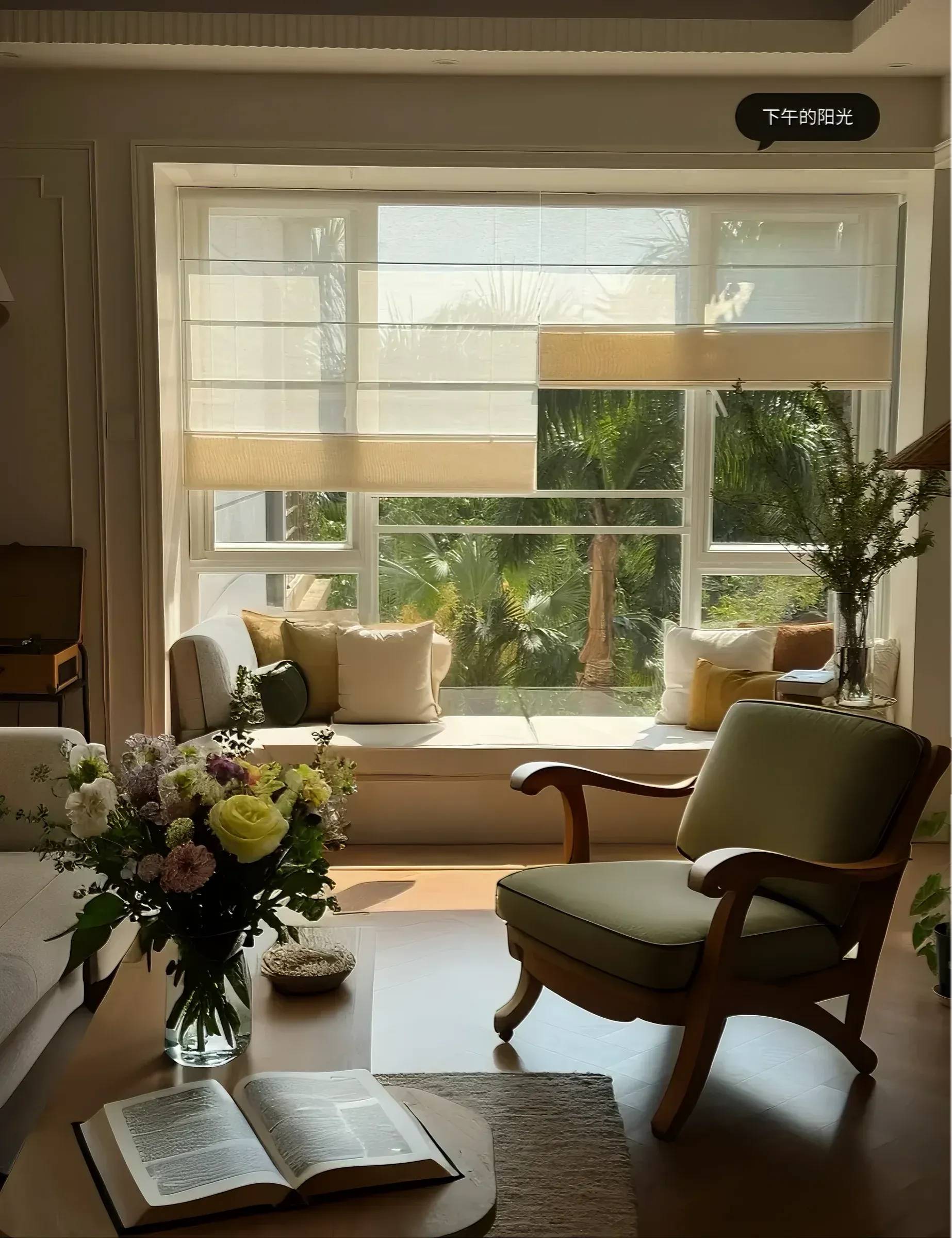 Cozy living room with wooden armchair, floral bouquet, open book, and sunlit window seat with cushions