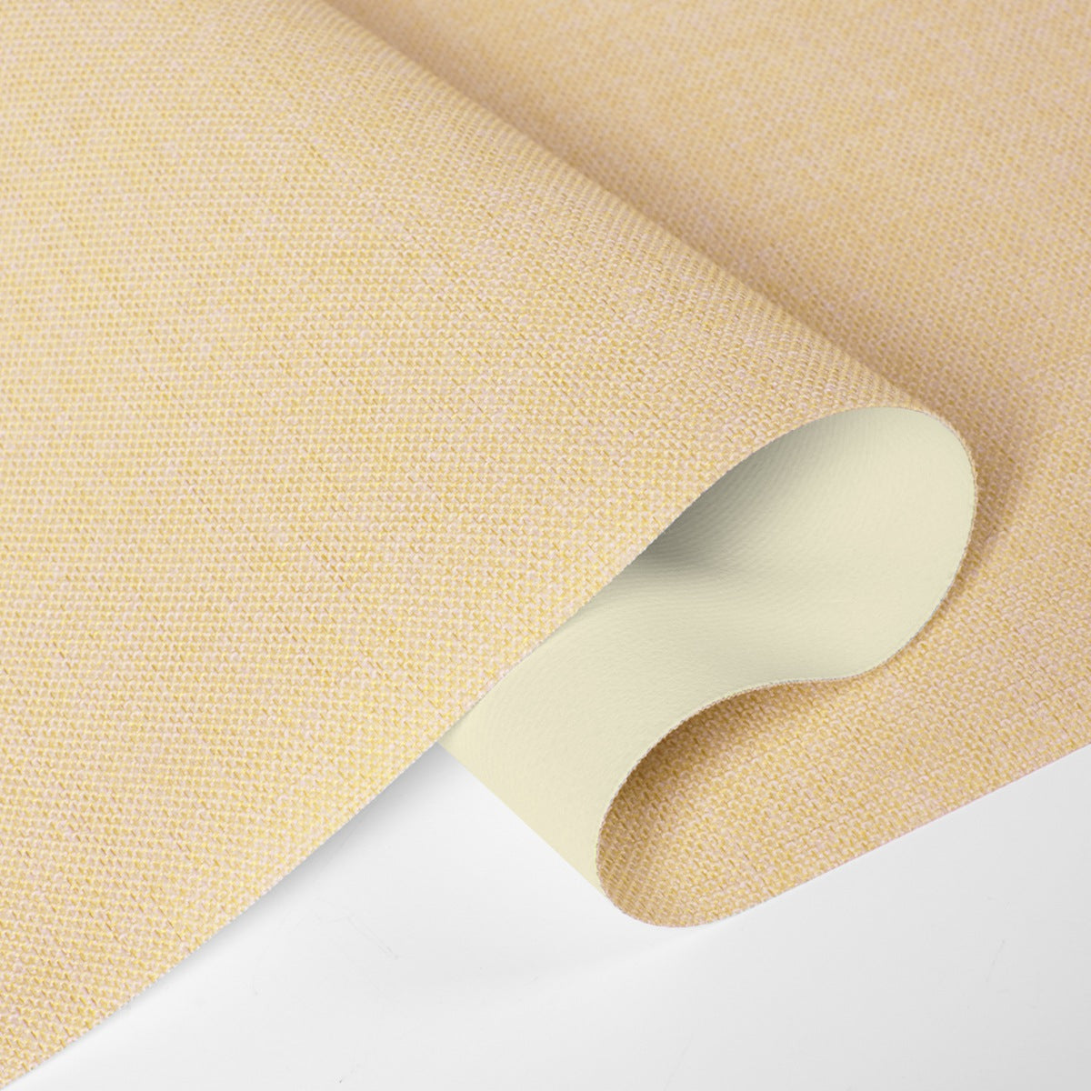 Close-up of beige textured wallpaper roll with a subtle woven pattern on white background