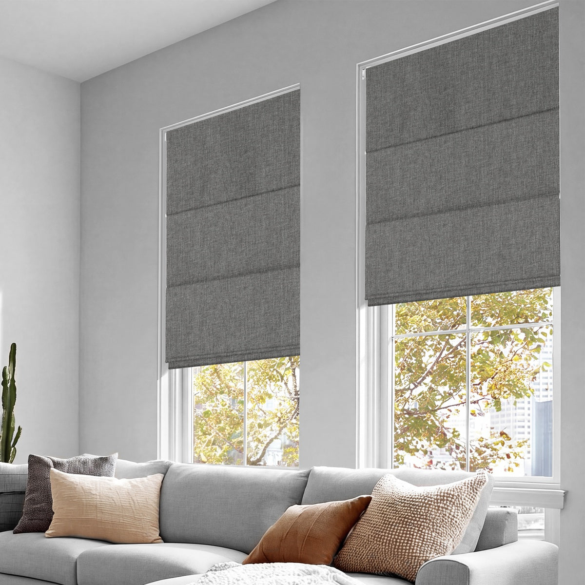 Sulugood No Drill Linen Fabric Cordless Blackout Roman Shades installed in modern living room windows.