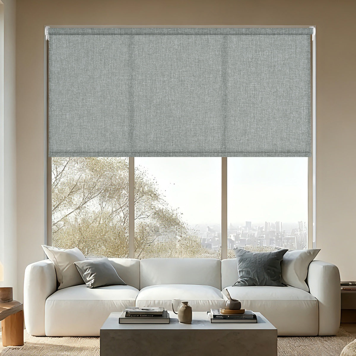 Modern living room with white sofa, gray cushions, concrete coffee table, and gray roller blind covering window