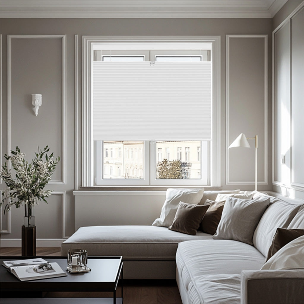 Modern living room with white cellular window blinds, beige sectional sofa, and decorative wall panels