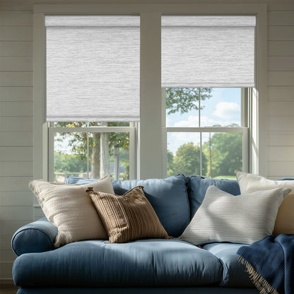 Sulugood Blckout Hand-Held Cassette Valance Roller Shades in a stylish living room with a blue couch.