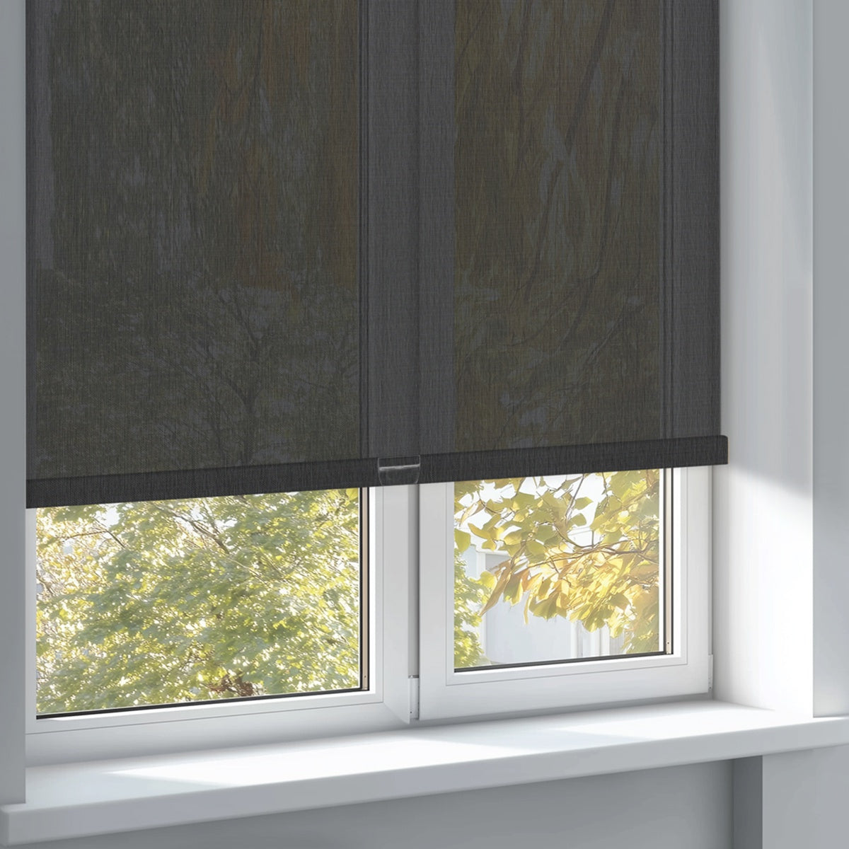 Sulugood Clearer Outdoor View Sunweave Fabric Roller Shades installed on a window with a view of greenery.