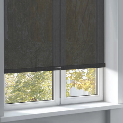 Sulugood Clearer Outdoor View Sunweave Fabric Roller Shades installed on a window with a view of greenery.