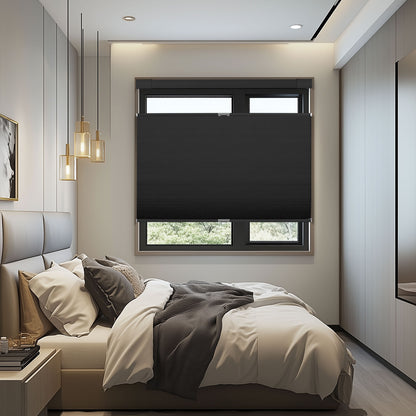 Modern bedroom with beige bed, black window blinds, hanging pendant lights, and neutral decor