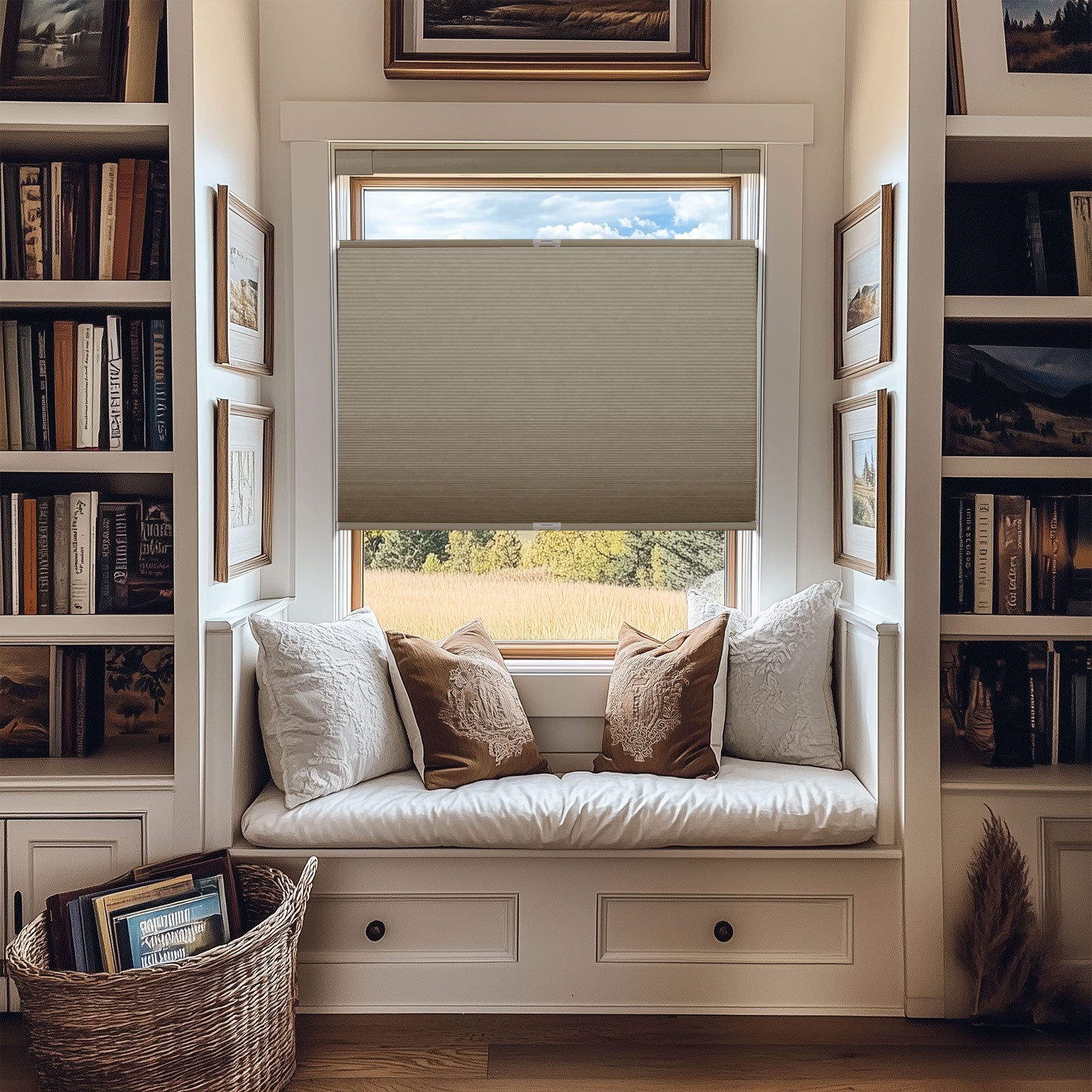 Cozy window seat with white and brown pillows, built-in bookshelves, and beige blinds partially down