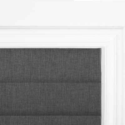Sulugood No Drill Linen Fabric Cordless Blackout Roman Shades installed in a stylish window frame.