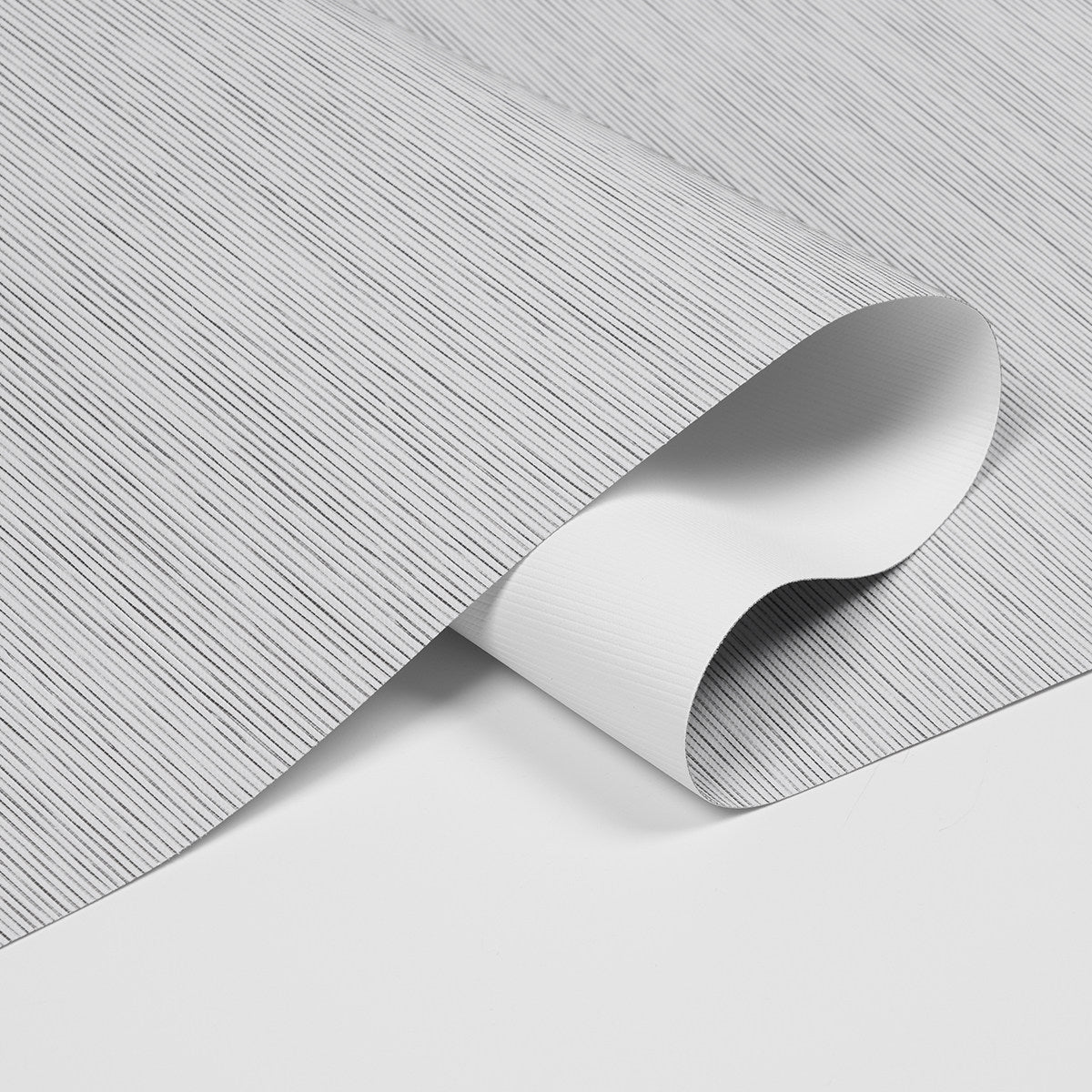 Close-up of textured fabric featuring a sleek striped design for home decor.