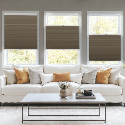 Sulugood Top-Down Bottom-Up Same Color With Casing Cellular Shade in a modern living room with a couch and coffee table.