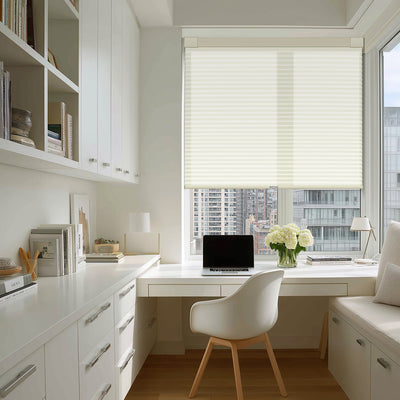 Sulugood No Drill Light Filtering Blackout Cellular Shade in a modern office with white furniture.